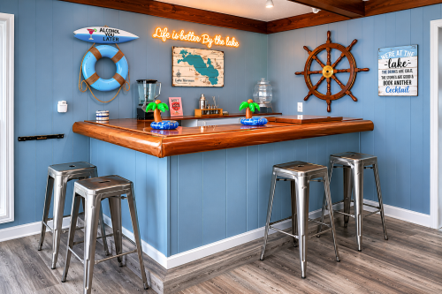 Bar counter with 4 seats along with a refrigerator 