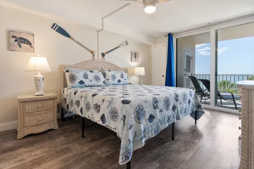 Spacious king-size bedroom with a private balcony and beautiful ocean views