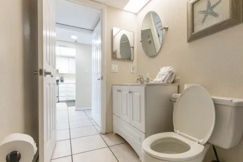 Second bathroom located off the kitchen and second bedroom