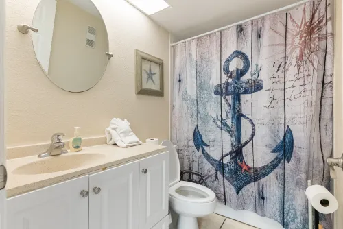 Second bathroom located across from kitchen and second bedroom