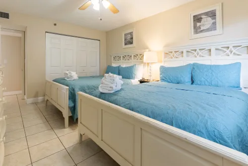 Second bedroom, two-queen beds with flat-screen TV and closet space