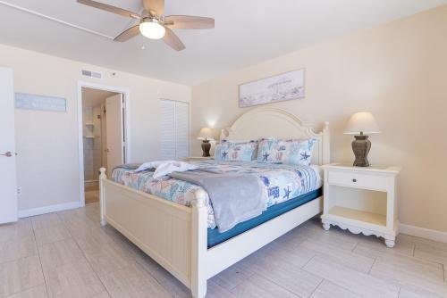 Master bedroom with king-sized bed, private bathroom, and a closet space 