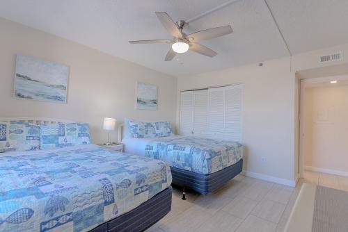 Second bedroom with 2 queen-sized beds, plenty of closet space, and a flat-screen TV