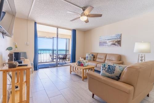 Living room having an ocean front view with flat-screen TV